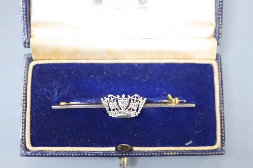 A 14ct, plat and diamond set coronet sweethearts bar brooch, 49mm, gross 3.7 grams, in Gieves box.